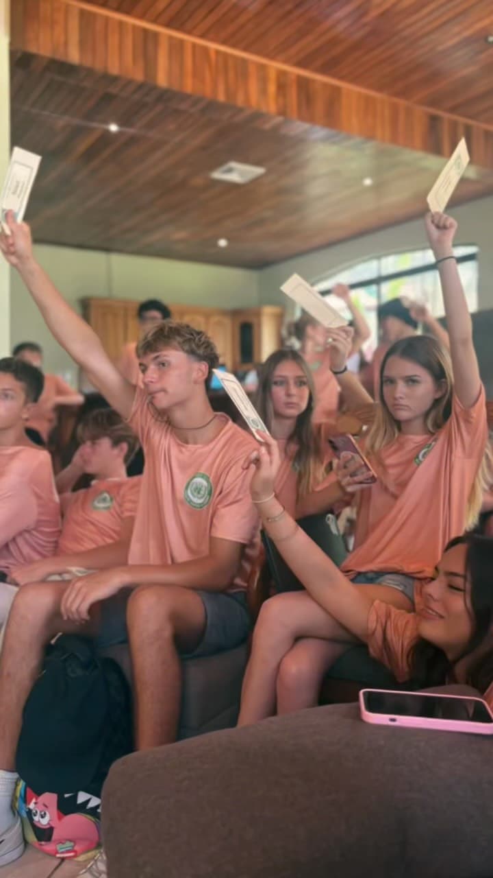 Student raising hand in class