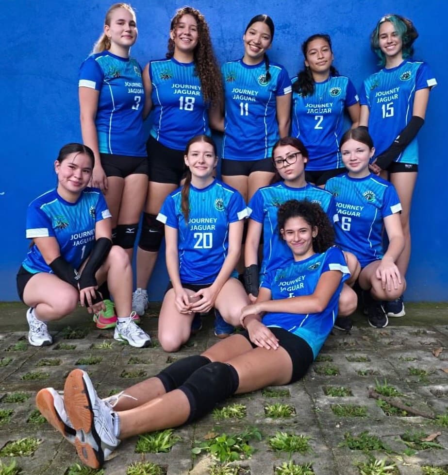 Journey Jaguars volleyball team in matching jerseys