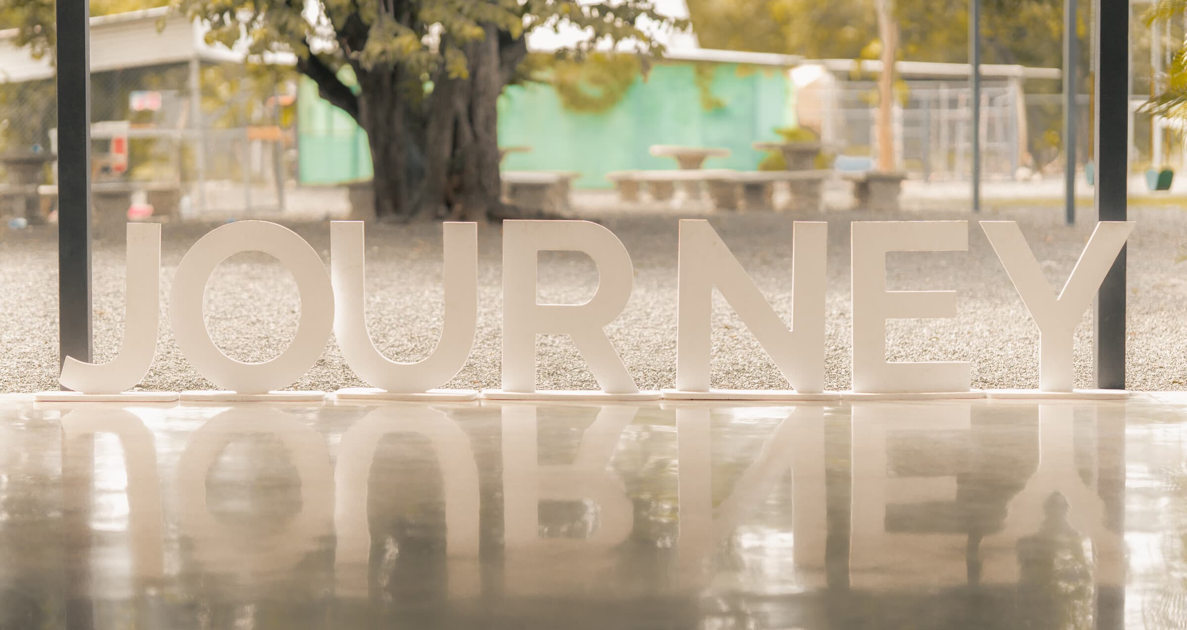 The big white JOURNEY letters at the Tamarindo campus entrance